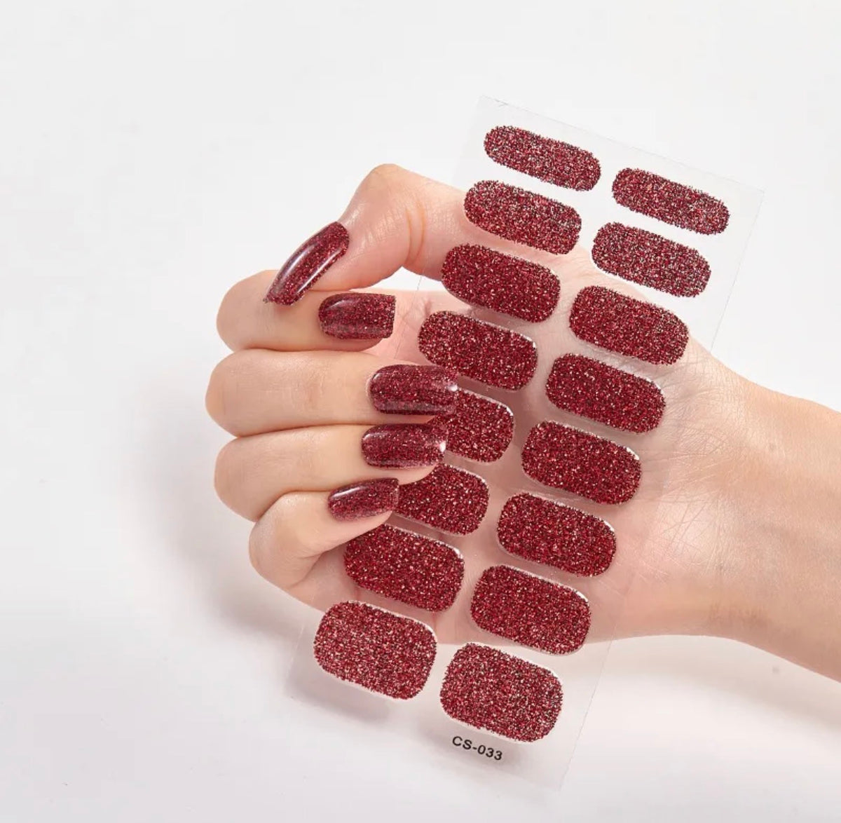 Vernis adhésif rouge pailleté